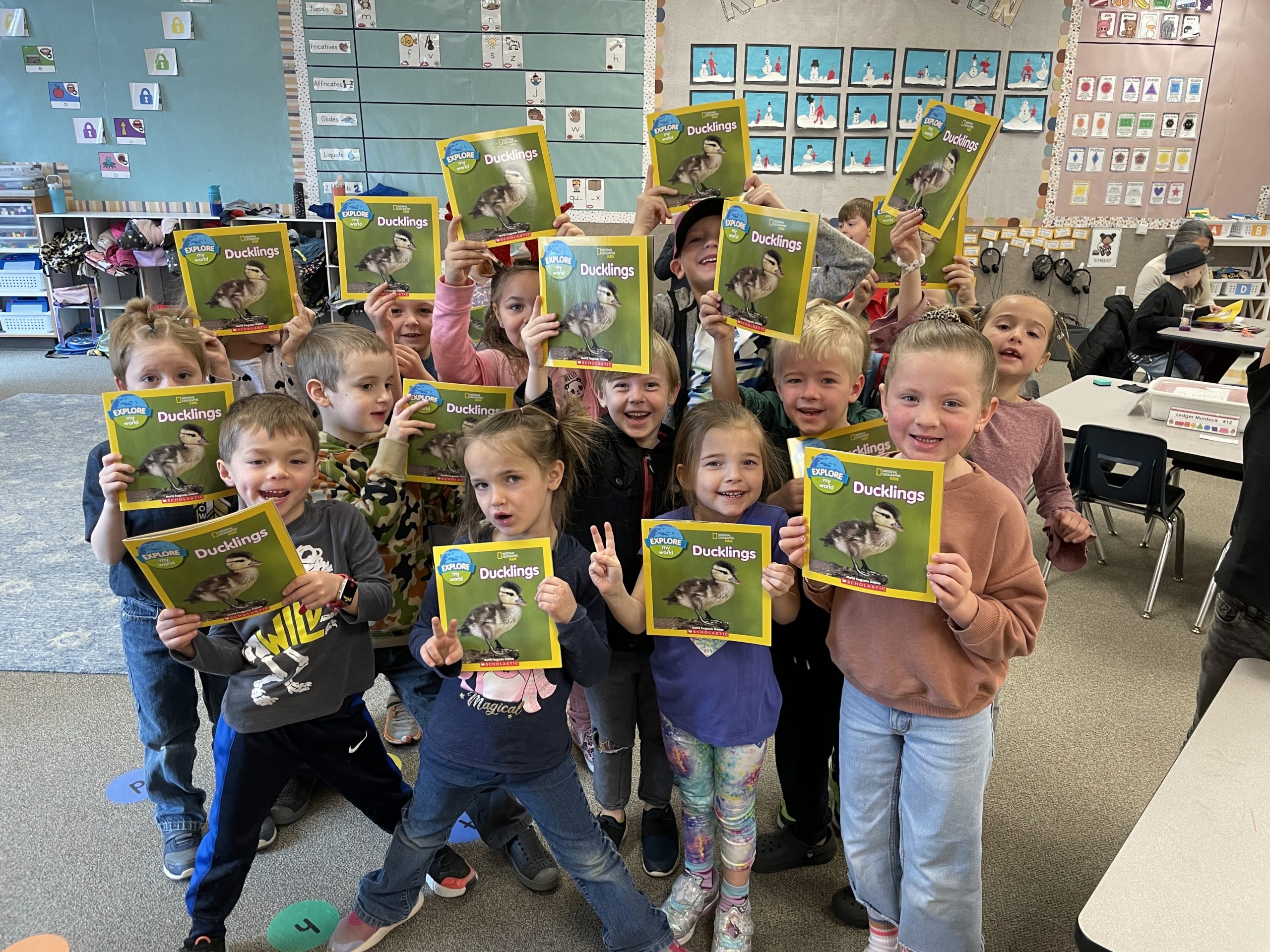 Kindergarten Readers showing their books.